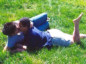 Lesbians in the grass kissing