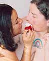 Lesbians feeding each other