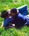Lesbians in the grass kissing
